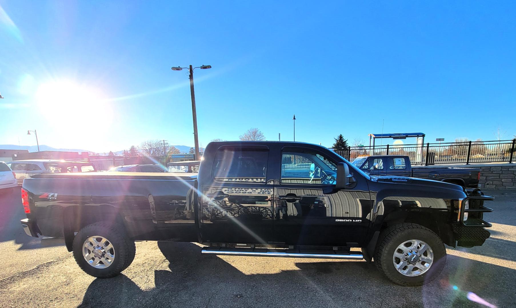 2014 Black /Black Chevrolet Silverado 2500HD LTZ (1GC1KYE87EF) with an 6.6L Duramax V8 engine, Allison Automatic transmission, located at 450 N Russell, Missoula, MT, 59801, (406) 543-6600, 46.874496, -114.017433 - Beast of a Truck. 1 Owner. Duramax Diesel. Allison Transmission. 4 Wheel Drive. Crewcab. Longbox. Power Sunroof. Running Boards. Air. Cruise. Tilt. Power Leather Seats. Heats Seats. Dual Climate Control. Tonneau Cover. Gooseneck Ball. Like NEW Tires. - Photo#4